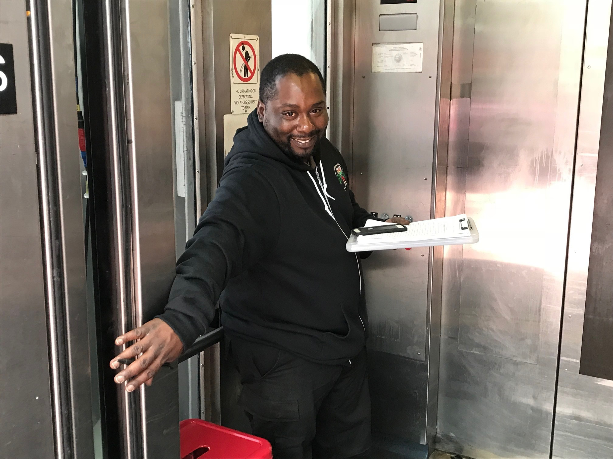 Charles Jones greets customers at the elevator